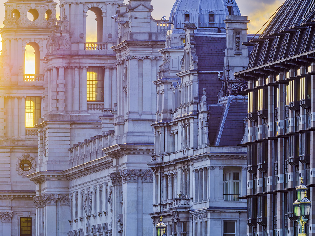 Image of buildings in London lit in dusk light